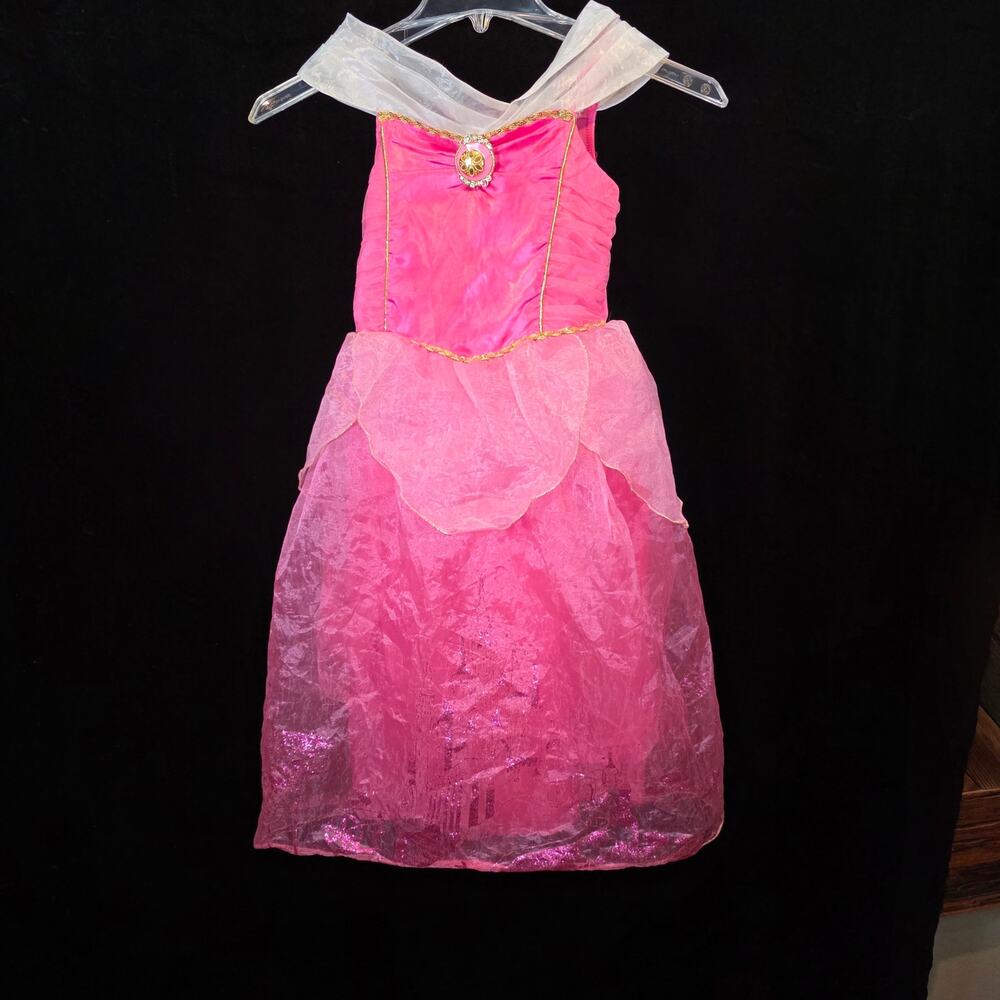Disney Princess Aurora Pink dress costume a sheer off-the-shoulder neckline.